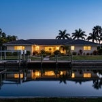 Cape Coral canal home at blue hour, illustrating Florida real estate owned by international families