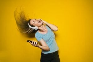Female with Headphones Singing in New Year