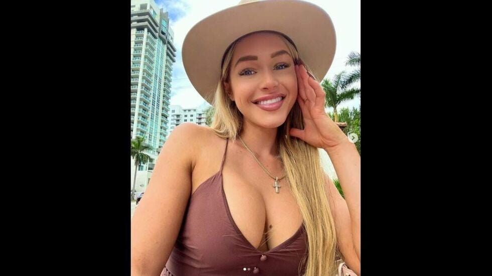 Courtney Clenney wearing a hat