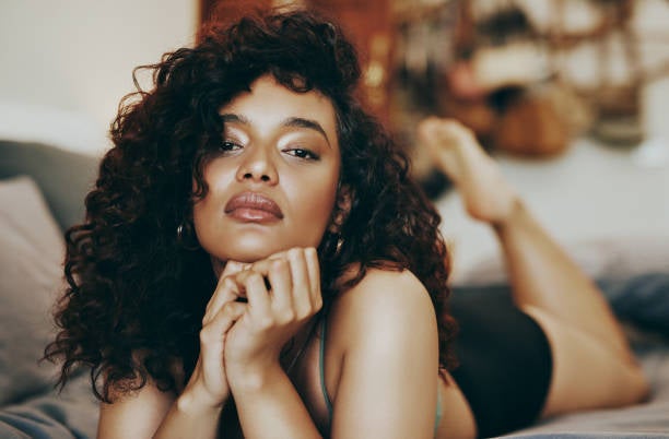 Pretty Black Woman on bed