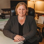 Portrait of Megan Metzinger, family law attorney at Higher Level Legal in Raymore, Missouri