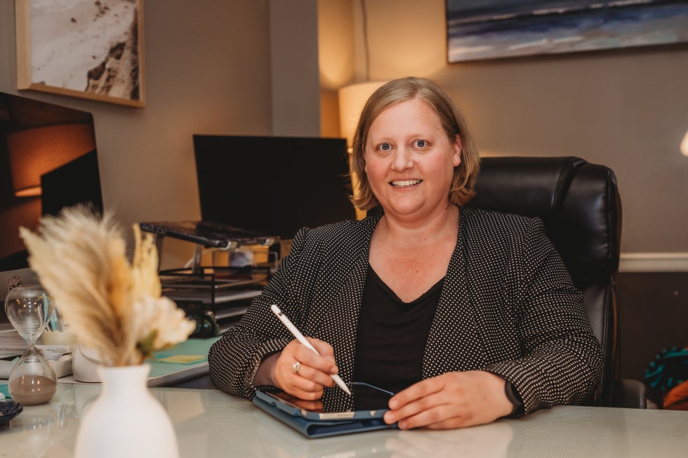 Portrait of Megan Metzinger, family law attorney at Higher Level Legal in Raymore, Missouri
