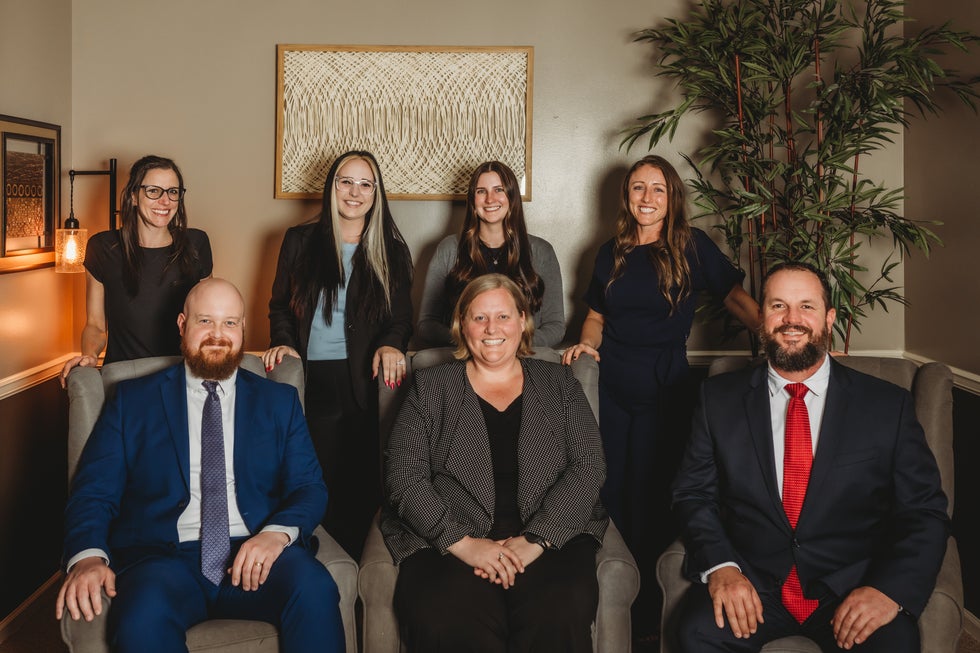 Group photo of the Higher Level Legal team in Raymore, Missouri, including attorneys and staff who handle family law, divorce, custody, and criminal defense cases