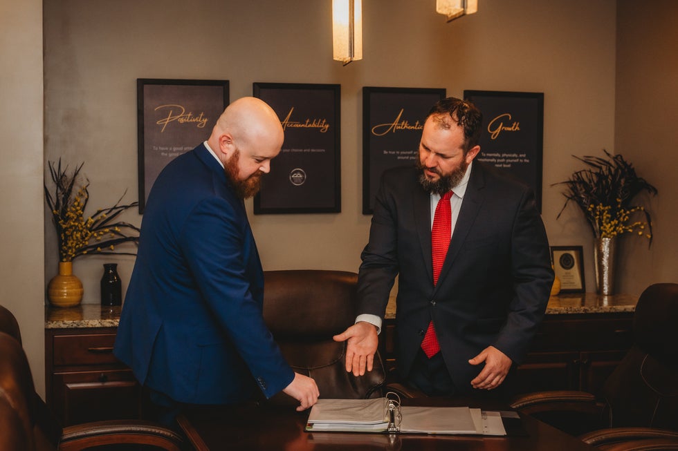 Portrait of Josh Wilson and Brady Shelton, attorneys at Higher Level Legal in Raymore, Missouri